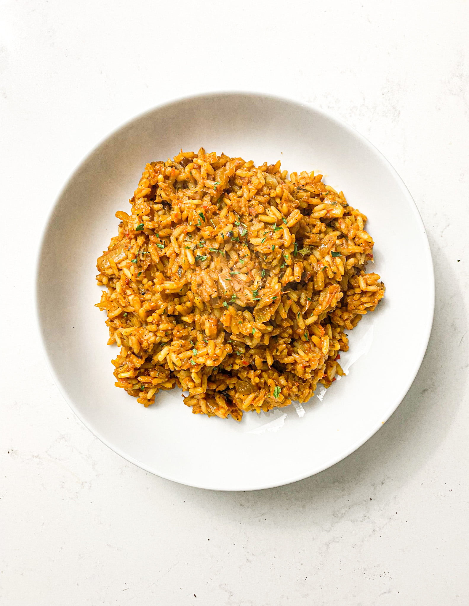 jollof rice without tomato paste in a white bowl